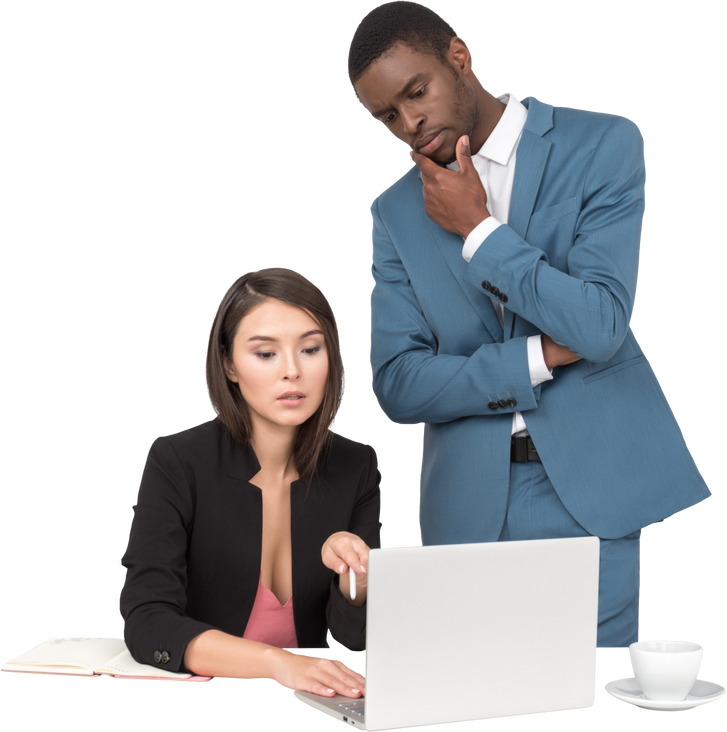 Man and Woman in Business Attire Looking at Laptop